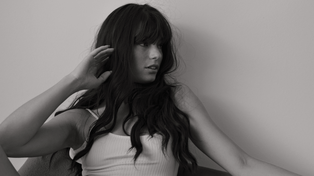 A woman reflecting on her wellness journey, representing the confidence and intimacy benefits of vaginoplasty.